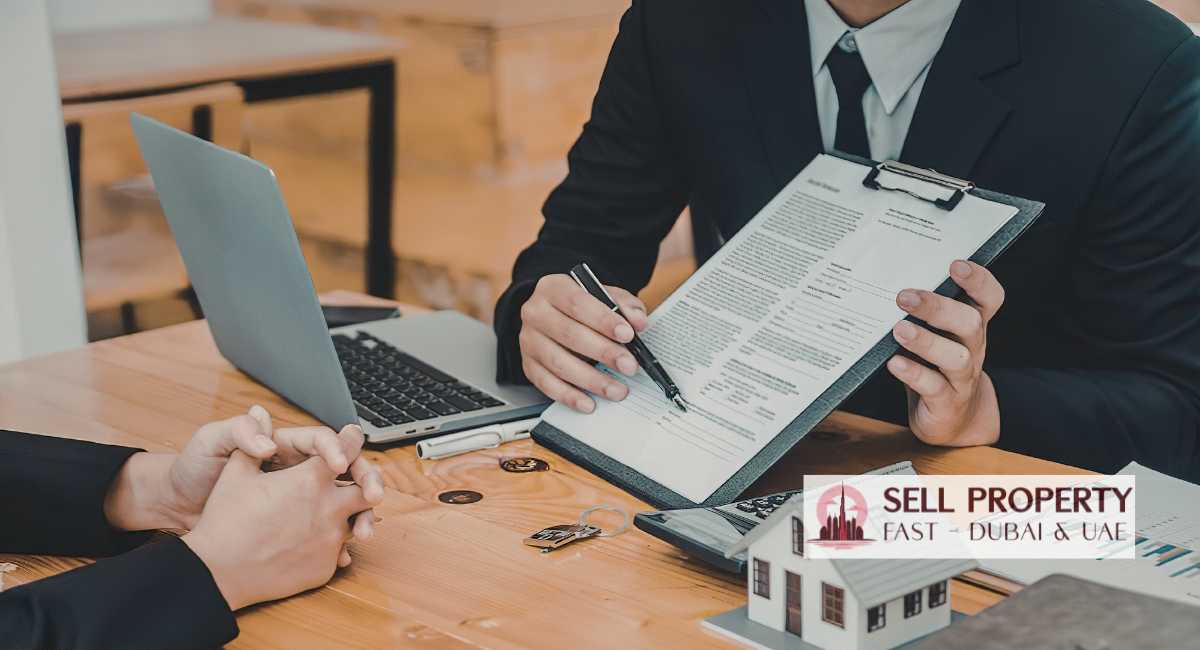 Couple in Dubai discussing sale of jointly owned property during divorce with an advisor